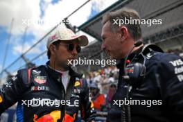 (L to R): Sergio Perez (MEX) Red Bull Racing with Christian Horner (GBR) Red Bull Racing Team Principal on the grid. 04.05.2024. Formula 1 World Championship, Rd 6, Miami Grand Prix, Miami, Florida, USA, Sprint and Qualifying Day.