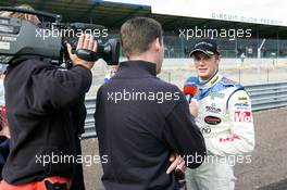 12.09.2004 Dijon, France, Sunday 12 September 2004, Norbert Siedler, AUT, ADM Motorsport, portrait, being interviewed by DSF, German Television - SUPERFUND EURO 3000 Championship Rd 7, Circuit Dijon-Prenois, France, FRA - SUPERFUND COPYRIGHT FREE editorial use only