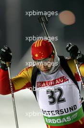 02.12.2010, Oestersund, Sweden (SWE): Chengye Zhang (CHN), Fischer, Salomon, Swix, adidas - IBU world cup biathlon, individual men, Oestersund (SWE). www.xpb.cc. © Manzoni/xpb.cc. Every downloaded picture is fee-liable.