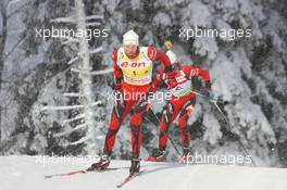 05.12.2010, Oestersund, Sweden (SWE): Emil Hegle Svendsen (NOR), Madshus, Rottefella, Swix, Odlo leads Ole Einar Bjoerndalen (NOR), Madshus, Rottefella, Odlo - IBU world cup biathlon, pursuit men, Oestersund (SWE). www.xpb.cc. © Manzoni/xpb.cc. Every downloaded picture is fee-liable.