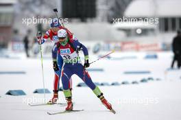 05.12.2010, Oestersund, Sweden (SWE): Andreja Mali (SLO), Fischer, Rottefella, Alpina, Leki leads Anna Bogaly-Titovets (RUS), Fischer, Rottefella, Alpina, OneWay, adidas - IBU world cup biathlon, pursuit women, Oestersund (SWE). www.xpb.cc. © Manzoni/xpb.cc. Every downloaded picture is fee-liable.