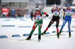 05.12.2010, Oestersund, Sweden (SWE): Darya Domracheva (BLR), Fischer, Rottefella, Swix leads Tina Bachmann (GER), Fischer, Rottefella, Swix, adidas  and Helena Ekholm (SWE), Fischer, Rottefella, Leki, adidas - IBU world cup biathlon, pursuit women, Oestersund (SWE). www.xpb.cc. © Manzoni/xpb.cc. Every downloaded picture is fee-liable.