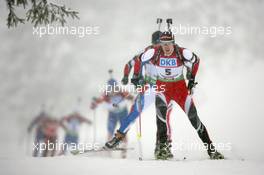 11.12.2010, Hochfilzen, Austria (AUT): Dominik Landertinger (AUT), Fischer, Rottefella, Leki - IBU world cup biathlon, pursuit men, Hochfilzen (AUT). www.xpb.cc. © Manzoni/xpb.cc. Every downloaded picture is fee-liable.