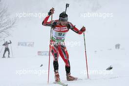 12.12.2010, Hochfilzen, Austria (AUT): Nathan Smith (CAN), Fischer, Rottefella, Alpina, Leki - IBU world cup biathlon, relay men, Hochfilzen (AUT). www.xpb.cc. © Manzoni/xpb.cc. Every downloaded picture is fee-liable.