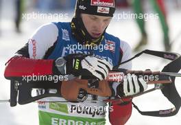 18.12.2010, Pokljuka, Slovenia (SLO): Dominik Landertinger (AUT), Fischer, Rottefella, Leki - IBU world cup biathlon, sprint men, Pokljuka (SLO). www.xpb.cc. © Miko/xpb.cc. Every downloaded picture is fee-liable.