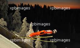 27.11.2010, Kuusamo, Finland (FIN): Ski jumper flying down in the dawn over Kuusamo - FIS world cup ski jumping, team HS142, Kuusamo (FIN). www.xpb.cc. Â© Felgenhauer/xpb.cc/NordicFocus. Every downloaded picture is fee-liable.