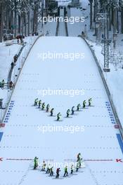 18.12.2010, Engelberg, Switzerland (SUI): Track marshalls prepare the hill - FIS world cup ski jumping, individual HS137, Engelberg (SUI). www.xpb.cc. © Manzoni/xpb.cc. Every downloaded picture is fee-liable.
