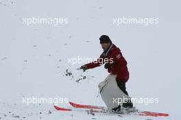17.12.2010, Engelberg, Switzerland (SUI): Track marshall distributes trees - FIS world cup ski jumping, replacing Harrachov, Engelberg (SUI). www.xpb.cc. © Manzoni/xpb.cc. Every downloaded picture is fee-liable.