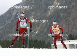 12.01.2011, Ruhpolding, Germany (GER): Ole Einar Bjoerndalen (NOR), Madshus, Rottefella, Odlo and Tarjei Boe (NOR), Fischer, Rottefella, Swix, ODLO - IBU world cup biathlon, individual men, Ruhpolding (GER). www.xpb.cc. © Manzoni/xpb.cc. Every downloaded picture is fee-liable.