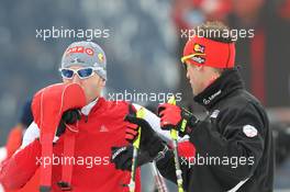 20.01.2011, Antholz, Italy (ITA): Simon Eder (AUT), Fischer, Rottefella, Swix and Christoph Sumann (AUT), Atomic, Leki  - IBU world cup biathlon, sprint men, Antholz (ITA). www.xpb.cc. © Manzoni/xpb.cc. Every downloaded picture is fee-liable.