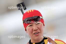 21.01.2011, Antholz, Italy (ITA): Xue Dong (CHN), Fischer, Salomon, Swix, adidas - IBU world cup biathlon, sprint women, Antholz (ITA). www.xpb.cc. © Manzoni/xpb.cc. Every downloaded picture is fee-liable.