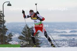 17.03.2011, Holmenkollen, Norway (NOR): Simon Eder (AUT), Fischer, Rottefella, Swix - IBU world cup biathlon, sprint men, Holmenkollen (NOR). www.xpb.cc. © Manzoni/xpb.cc. Every downloaded picture is fee-liable.