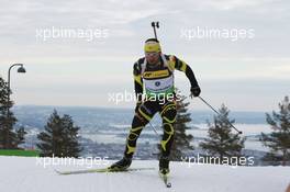17.03.2011, Holmenkollen, Norway (NOR): Simon Fourcade (FRA), Fischer, Rottefella, Rossignol, Swix, Odlo - IBU world cup biathlon, sprint men, Holmenkollen (NOR). www.xpb.cc. © Manzoni/xpb.cc. Every downloaded picture is fee-liable.