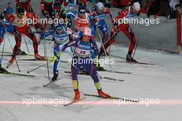 12.03.2011, Khanty-Mansiysk, Russia (RUS): Klemen Bauer (SLO), Fischer, Rottefella, Alpina, Swix leads the field over the intermediate time - IBU world championships biathlon, mass men, Khanty-Mansiysk (RUS). www.xpb.cc. © Manzoni/xpb.cc. Every downloaded picture is fee-liable.