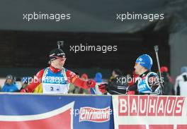 11.03.2011, Khanty-Mansiysk, Russia (RUS): Tarjei Boe (NOR), Fischer, Rottefella, Swix, ODLO, Michael Greis (GER), Madshus, Rottefella, OneWay, adidas - IBU world championships biathlon, relay men, Khanty-Mansiysk (RUS). www.xpb.cc. © Manzoni/xpb.cc. Every downloaded picture is fee-liable.