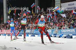 11.03.2011, Khanty-Mansiysk, Russia (RUS): Emil Hegle Svendsen (NOR), Madshus, Rottefella, Swix, Odlo leads Arnd Peiffer (GER), Fischer, Salomon, Swix, adidas, and Maxim Maksimov (RUS), Madshus, Rottefella, Swix, adidas - IBU world championships biathlon, relay men, Khanty-Mansiysk (RUS). www.xpb.cc. © Manzoni/xpb.cc. Every downloaded picture is fee-liable.