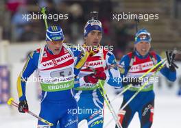 03.03.2011, Khanty-Mansiysk, Russia (RUS): Carl-Johan Bergman (SWE), Rossignol, Rottefella, Leki, adidas leads Martin Fourcade (FRA), Rossignol, Rottefella, OneWay, Odlo and Timo Antila (FIN), Peltonen, Rottefella, Alpina, One Way - IBU world championships biathlon, relay mixed, Khanty-Mansiysk (RUS). www.xpb.cc. Â© Miko/xpb.cc. Every downloaded picture is fee-liable.