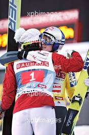 03.01.2011, Innsbruck, Austria (AUT): Tom Hilde (NOR), Fischer, gives congratulations to Thomas Morgenstern (AUT), Fischer  - FIS world cup ski jumping, four hills tournament, individual HS130, Innsbruck (AUT). www.xpb.cc. Â© Felgenhauer/xpb.cc. Every downloaded picture is fee-liable.