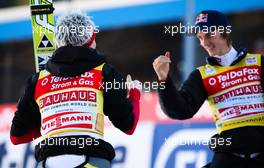 06.02.2011, Oberstdorf, Germany (GER): (r-l) Gregor Schlierenzauer (AUT), Fischer congratulates his team mate Thomas Morgenstern (AUT), Fischer  - FIS world cup ski jumping, team HS213, Oberstdorf (GER). www.xpb.cc. © Laiho/xpb.cc. Every downloaded picture is fee-liable.