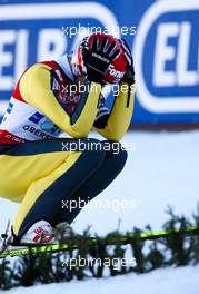 06.02.2011, Oberstdorf, Germany (GER):  disappointed Matti Hautamaeki (FIN), Fischer, holds his head - FIS world cup ski jumping, team HS213, Oberstdorf (GER). www.xpb.cc. © Laiho/xpb.cc. Every downloaded picture is fee-liable.