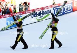 06.02.2011, Oberstdorf, Germany (GER): (l-r) Thomas Morgenstern (AUT), Fischer and Andreas Kofler (AUT), Fischer on the way to the victory ceremony  - FIS world cup ski jumping, team HS213, Oberstdorf (GER). www.xpb.cc. © Laiho/xpb.cc. Every downloaded picture is fee-liable.