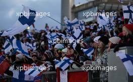 12.03.2011, Lahti, Finland (FIN): lots of finnish flags while a finn jumps  - FIS world cup ski jumping, team HS130, Lahti (FIN). www.xpb.cc. © Laiho/xpb.cc. Every downloaded picture is fee-liable.