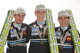 18.03.2011, Planica, Slovenia (SLO): Slovenian Ski Jumping Team, l-r: Robert Kranjec (SLO), Fischer, Jurij Tepes (SLO), Fischer, Jernej Damjan (SLO), Fischer  - FIS world cup ski jumping final, medals, Planica (SLO). www.xpb.cc. © Hemmersbach/xpb.cc. Every downloaded picture is fee-liable.
