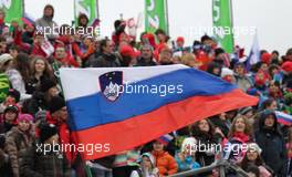 17.03.2011, Planica, Slovenia (SLO): slovenian flag in front of the spectators - FIS world cup ski jumping final, training, Planica (SLO). www.xpb.cc. © Hemmersbach/xpb.cc. Every downloaded picture is fee-liable.