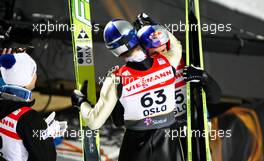 03.03.2011, Oslo, Norway (NOR):  (l-r) Thomas Morgenstern (AUT), Fischer congratulates the world champion Gregor Schlierenzauer (AUT), Fischer  - FIS nordic world ski championships, ski jumping, individual HS134, Oslo (NOR). www.xpb.cc. © Laiho/xpb.cc. Every downloaded picture is fee-liable.