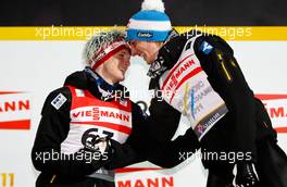 03.03.2011, Oslo, Norway (NOR):  (l-r) Thomas Morgenstern (AUT), Fischer congratulates the winner Gregor Schlierenzauer (AUT), Fischer - FIS nordic world ski championships, ski jumping, individual HS134, Oslo (NOR). www.xpb.cc. © Laiho/xpb.cc. Every downloaded picture is fee-liable.