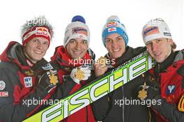 27.02.2011, Oslo, Norway (NOR): Gold Medal Team; Team Austria, l-r: Thomas Morgenstern, Andreas Kofler, Gregor Schlierenzauer, Martin Koch - FIS nordic world ski championships, ski jumping, medals, Oslo (NOR). www.xpb.cc. © Hemmersbach/xpb.cc. Every downloaded picture is fee-liable.