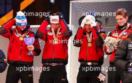 27.02.2011, Oslo, Norway (NOR):  permission to wear hats again after national anthem, the winner team, Austria, (l-r) Gregor Schlierenzauer (AUT), Fischer, Martin Koch (AUT), Fischer, Andreas Kofler (AUT), Fischer and Thomas Morgenstern (AUT), Fischer  - FIS nordic world ski championships, ski jumping, team HS106, Oslo (NOR). www.xpb.cc. © Laiho/xpb.cc. Every downloaded picture is fee-liable.