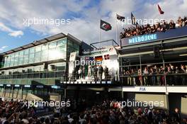 The podium (L to R): Daniel Ricciardo (AUS) Red Bull Racing, second; Nico Rosberg (GER) Mercedes AMG F1, race winner; Kevin Magnussen (DEN) McLaren, third. 16.03.2014. Formula 1 World Championship, Rd 1, Australian Grand Prix, Albert Park, Melbourne, Australia, Race Day.