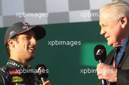 (L to R): Daniel Ricciardo (AUS) Red Bull Racing is interviewed by Alan Jones (AUS) on the podium. 16.03.2014. Formula 1 World Championship, Rd 1, Australian Grand Prix, Albert Park, Melbourne, Australia, Race Day.