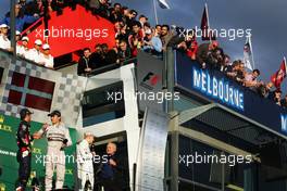 The podium (L to R): Daniel Ricciardo (AUS) Red Bull Racing, second; Nico Rosberg (GER) Mercedes AMG F1, race winner; Kevin Magnussen (DEN) McLaren, third; Alan Jones (AUS). 16.03.2014. Formula 1 World Championship, Rd 1, Australian Grand Prix, Albert Park, Melbourne, Australia, Race Day.