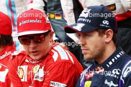(L to R): Kimi Raikkonen (FIN) Ferrari with Sebastian Vettel (GER) Red Bull Racing at the drivers start of season photograph. 16.03.2014. Formula 1 World Championship, Rd 1, Australian Grand Prix, Albert Park, Melbourne, Australia, Race Day.