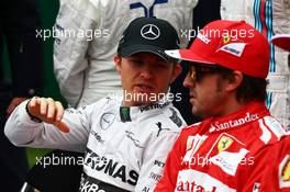 (L to R): Nico Rosberg (GER) Mercedes AMG F1 and Fernando Alonso (ESP) Ferrari at the drivers start of season photograph. 16.03.2014. Formula 1 World Championship, Rd 1, Australian Grand Prix, Albert Park, Melbourne, Australia, Race Day.
