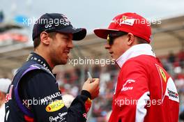 (L to R): Sebastian Vettel (GER) Red Bull Racing with Kimi Raikkonen (FIN) Ferrari on the drivers parade. 16.03.2014. Formula 1 World Championship, Rd 1, Australian Grand Prix, Albert Park, Melbourne, Australia, Race Day.