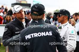 (L to R): Jenson Button (GBR) McLaren with Nico Rosberg (GER) Mercedes AMG F1 and Lewis Hamilton (GBR) Mercedes AMG F1 on the drivers parade. 16.03.2014. Formula 1 World Championship, Rd 1, Australian Grand Prix, Albert Park, Melbourne, Australia, Race Day.