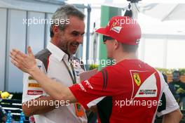 (L to R): Beat Zehnder (SUI) Sauber F1 Team Manager with Kimi Raikkonen (FIN) Ferrari. 13.03.2014. Formula 1 World Championship, Rd 1, Australian Grand Prix, Albert Park, Melbourne, Australia, Preparation Day.