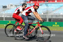 Fernando Alonso (ESP) Ferrari cycles the circuit with Edoardo Bendinelli (ITA) Personal Trainer. 12.03.2014. Formula 1 World Championship, Rd 1, Australian Grand Prix, Albert Park, Melbourne, Australia, Preparation Day.