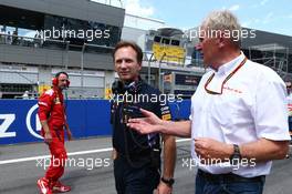 (L to R): Christian Horner (GBR) Red Bull Racing Team Principal with Dr Helmut Marko (AUT) Red Bull Motorsport Consultant on the grid. 22.06.2014. Formula 1 World Championship, Rd 8, Austrian Grand Prix, Spielberg, Austria, Race Day.