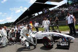 Pole sitter Felipe Massa (BRA) Williams FW36 arrives on the grid. 22.06.2014. Formula 1 World Championship, Rd 8, Austrian Grand Prix, Spielberg, Austria, Race Day.