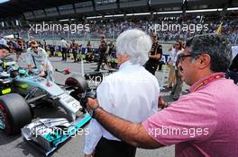 Muhammed Al Khalifa (BRN) Bahrain Circuit Chairman on the grid with Bernie Ecclestone (GBR). 22.06.2014. Formula 1 World Championship, Rd 8, Austrian Grand Prix, Spielberg, Austria, Race Day.