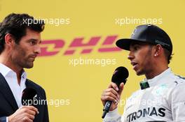 Second placed Lewis Hamilton (GBR) Mercedes AMG F1 on the podium with Mark Webber (AUS) Porsche Team WEC Driver. 22.06.2014. Formula 1 World Championship, Rd 8, Austrian Grand Prix, Spielberg, Austria, Race Day.
