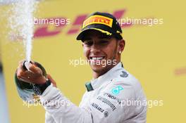 Lewis Hamilton (GBR) Mercedes AMG F1 celebrates his second position on the podium. 22.06.2014. Formula 1 World Championship, Rd 8, Austrian Grand Prix, Spielberg, Austria, Race Day.