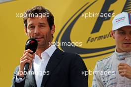 Mark Webber (AUS) Porsche Team WEC Driver on the podium. 22.06.2014. Formula 1 World Championship, Rd 8, Austrian Grand Prix, Spielberg, Austria, Race Day.