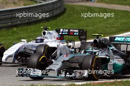 Nico Rosberg (GER) Mercedes AMG F1 W05 and Valtteri Bottas (FIN) Williams FW36 battle for position. 22.06.2014. Formula 1 World Championship, Rd 8, Austrian Grand Prix, Spielberg, Austria, Race Day.