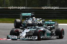 Nico Rosberg (GER) Mercedes AMG F1 W05 and Lewis Hamilton (GBR) Mercedes AMG F1. 22.06.2014. Formula 1 World Championship, Rd 8, Austrian Grand Prix, Spielberg, Austria, Race Day.