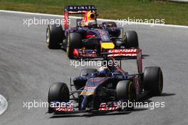 Jean-Eric Vergne (FRA) Scuderia Toro Rosso STR9 leads Sebastian Vettel (GER) Red Bull Racing RB10. 22.06.2014. Formula 1 World Championship, Rd 8, Austrian Grand Prix, Spielberg, Austria, Race Day.